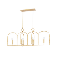 A modern Morada chandelier with an open, arched metal frame and clear, round bulbs on straight candle holders, finished in gold leaf.