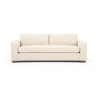 A beige Vero Sofa with a simple and modern design, featuring a low profile and square arms, set against a white background.