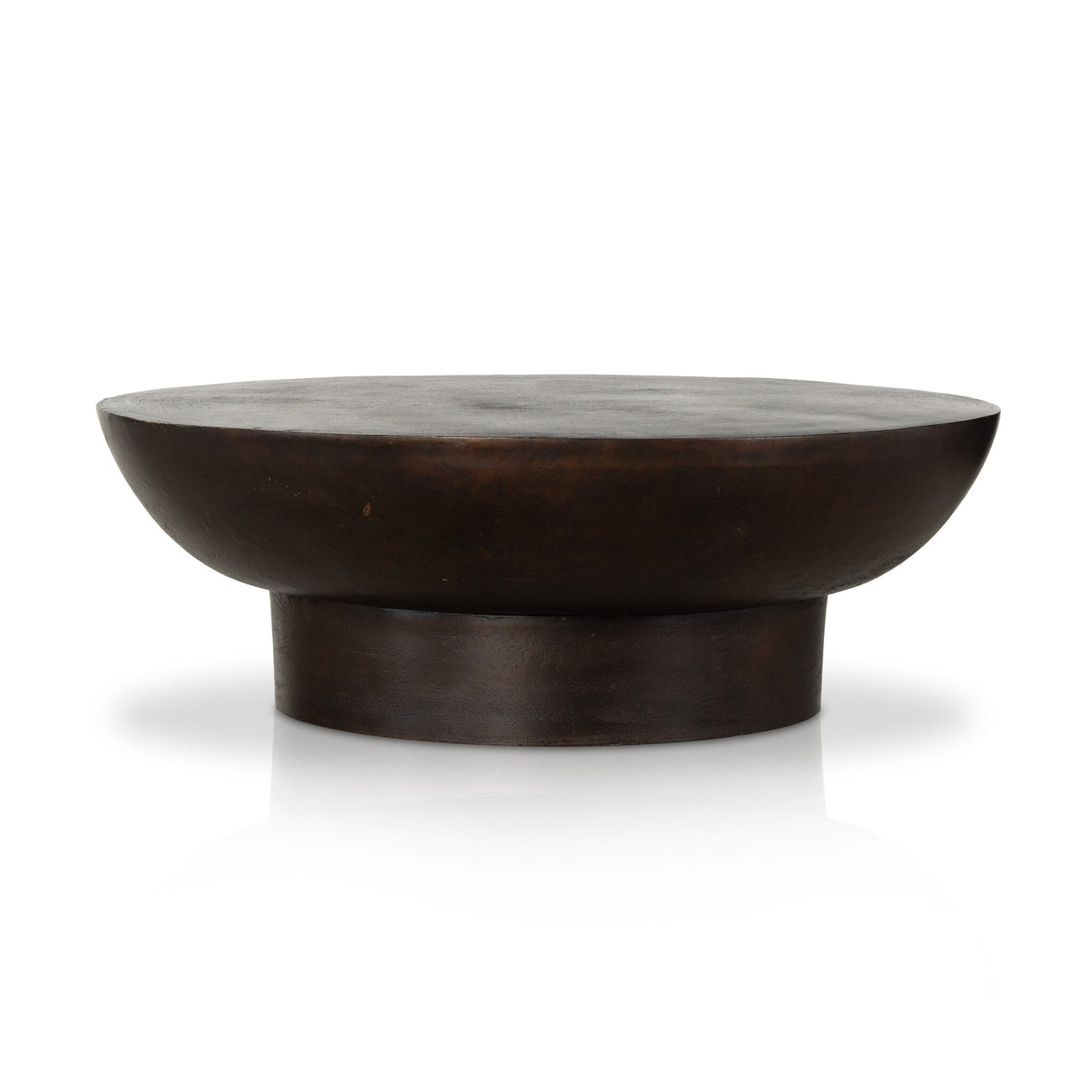 A round, vintage-style Salton coffee table with a dark, textured surface and a rounded mirrored edge.