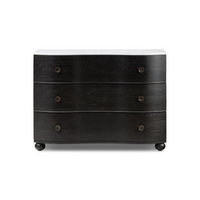 A distressed black oak chest with three drawers and a polished white marble top.