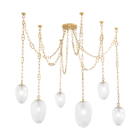 Chandelier with gold chains and white glass shades on a white background