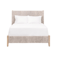 A beige Carolina Woven Cal King Bed with white bedding, made of sustainable natural Abaca Rope and Solid Mahogany Wood.