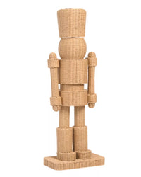 Wicker nutcracker figure on a white background