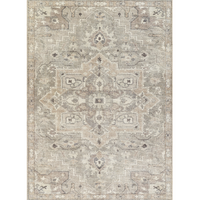 A traditional style Elle Collection rug with a detailed medallion design in warm gray tones.