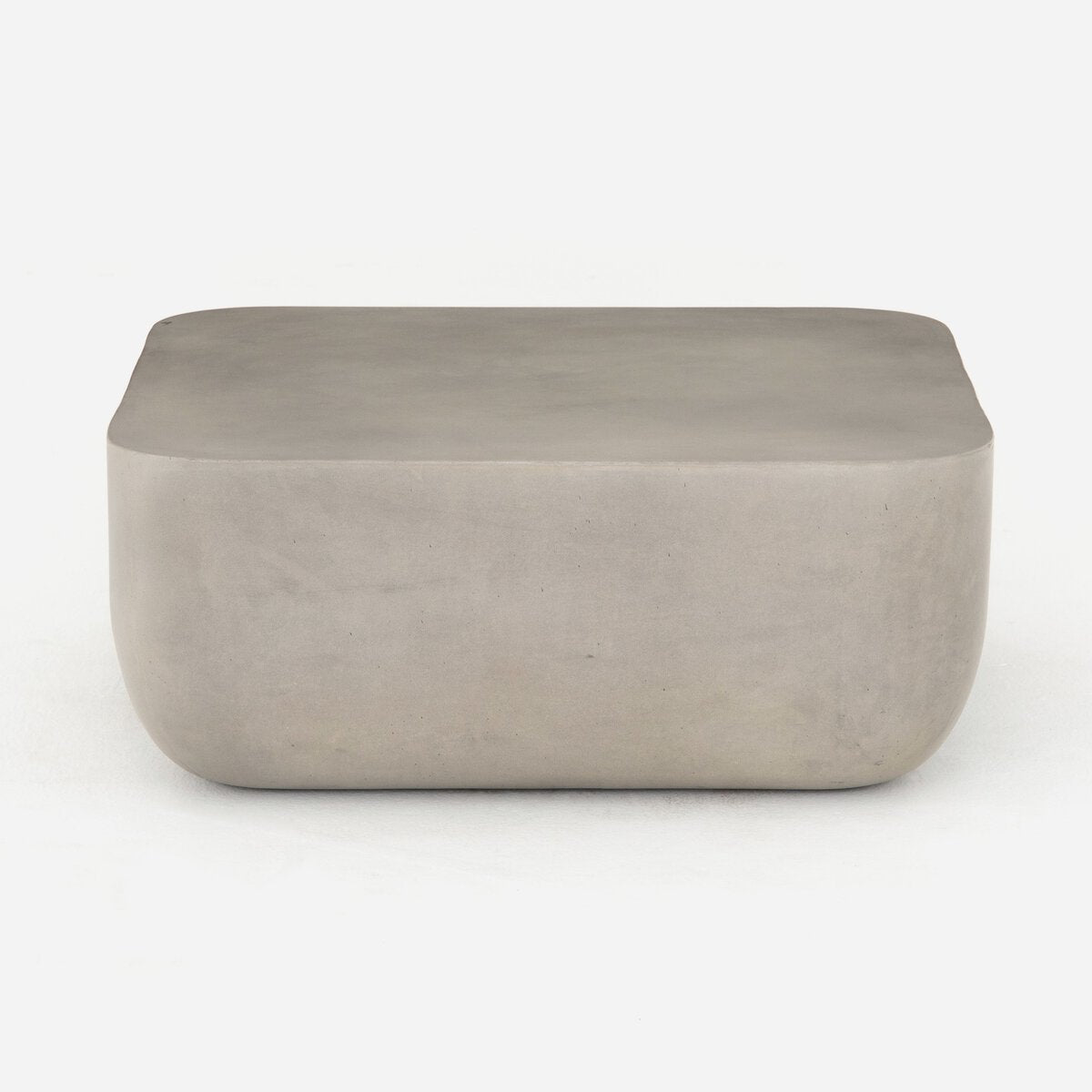 Rectangular concrete ottoman on a white background